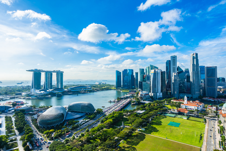 Beautiful architecture building exterior cityscape in Singapore city skyline with white cloud on blue skyのeditorial素材