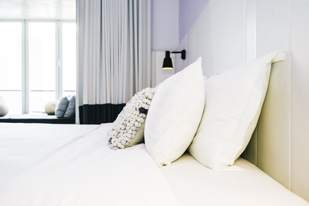 White pillow and blanket on bed decoration in beautiful luxury bedroom interiorの写真素材