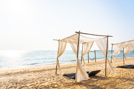 Chair umbrella and lounge on the beautiful beach sea ocean on sky for leisure travel and vacation...