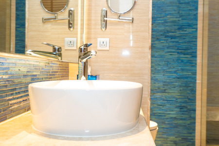 Water faucet tap and white sink decoration in bathroom interior of roomの写真素材