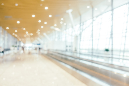 Abstract blur and defocused airport passenger terminal for transportation interior for backgroundの写真素材