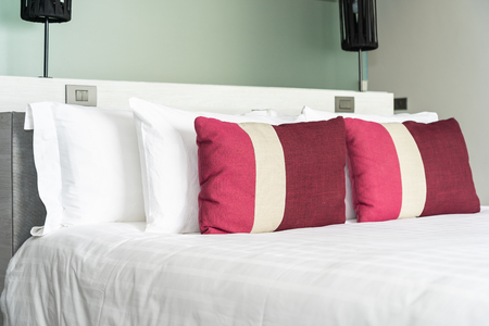 Beautiful comfortable pillow and blanket on bed decoration interior of bedroomの写真素材