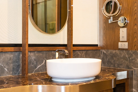 Sink and water tap faucet decoration in bathroom interiorの写真素材