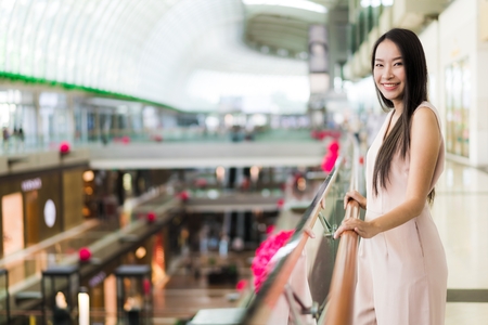 Beautiful asian woman smile and happy in shopping mall of department store interiorの写真素材