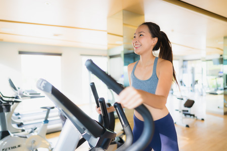 Portrait asian woman exercising workout and training in gym for healthyの写真素材