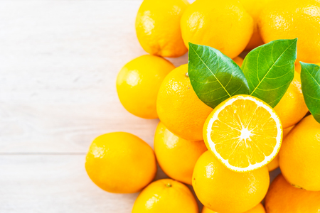 Fresh oranges fruit on wood table - Healthy food conceptの写真素材