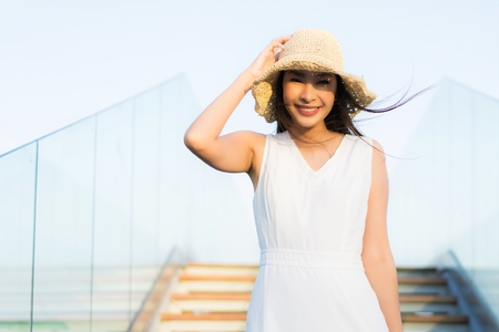 Portrait beautiful young asian woman happy and smile on the beach sea and ocean for travel and vacationの写真素材