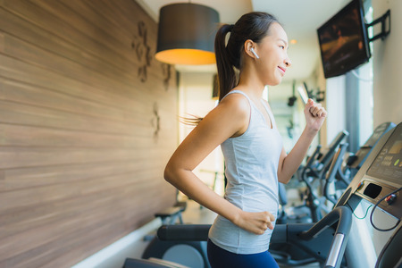 Portrait beautiful young sport asian woman exercise and work out with fitness equipment in gym...