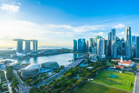 Beautiful architecture building exterior cityscape in Singapore city skyline with white cloud on blue skyのeditorial素材