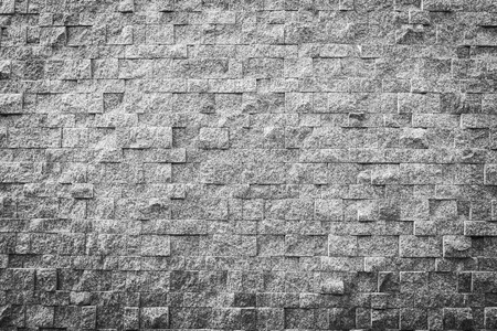 Gray and black color stone brick texture and surface with copy space for backgroundの写真素材