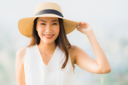 Portrait beautiful young asian woman smile happy and feel free with outdoor background for freedom conceptの写真素材