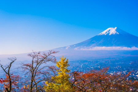 Beautiful landscape of mountain fuji around maple leaf tree with white cloud and blue sky in autumn season at Yamanashi Japanの写真素材
