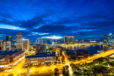 Beautiful architecture building exterior of singapore city skyline at twilight and night timeのeditorial素材