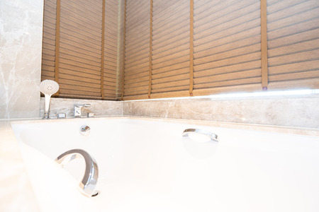 Beautiful luxury bathtub and faucet water tap decoration interior of bathroomの写真素材