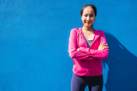 Portrait asian woman in sport wear with smile and ready for workout and exercisingの写真素材
