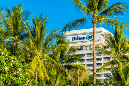 Hua hin , Thailand 2 May 2019 - Hilton hotel sign at hua hin with coconut palm tree in Thailandのeditorial素材