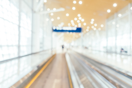 Abstract blur and defocused airport passenger terminal for transportation interior for backgroundの写真素材