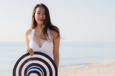 Portrait beautiful young asian woman happy and smile on the beach sea and ocean for travel and vacationの写真素材