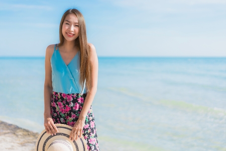 Portrait beautiful young asian woman happy smile relax around beach ocean and sea for leisure travel and vacationの写真素材
