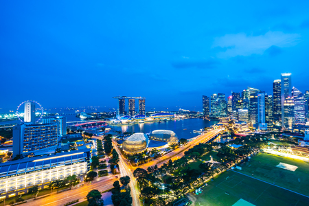 Beautiful architecture building exterior of singapore city skyline at twilight and night timeのeditorial素材