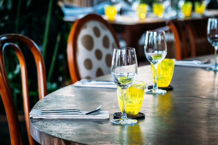 Wine glass with dining set prepare for breakfast lunch or dinner on table in restaurant and cafe