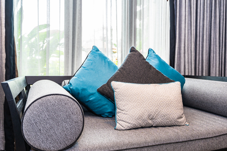 Beautiful comfortable pillow on sofa bed decoration in living room area interiorの写真素材