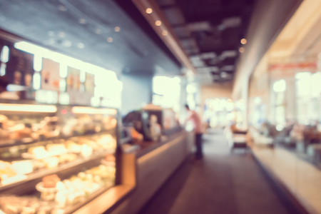 Abstract blur and defocus coffee shop cafe and restaurant interior for backgroundの写真素材