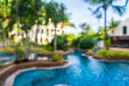 Abstract blur and defocus beautiful outdoor swimming pool in hotel resort for leisure relax in...