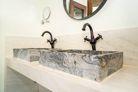 Sink and water faucet tap decoration in bathroom and toilet interiorの写真素材