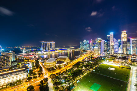 Beautiful architecture building exterior of singapore city skyline at twilight and night timeのeditorial素材