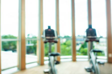 Abstract blur and defocus fitness equipment in gym room interior for exercise