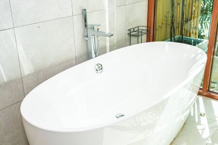 Beautiful White luxury bathtub decoration in bathroom interiorの写真素材