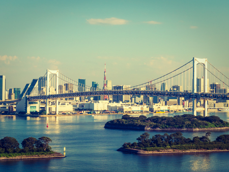 Beautiful cityscape with architecture building and rainbow bridge in tokyo city japan on blue sky and white cloudのeditorial素材