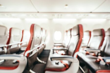 Abstract blur and defocused passenger seat interior of airplane for backgroundの写真素材