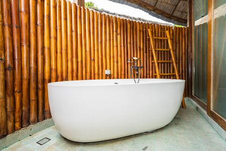 Beautiful luxury white bathtub decoration in bathroom interior for relax leisureの写真素材