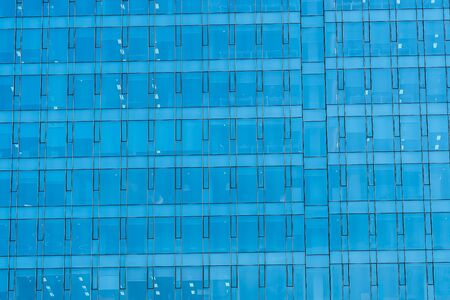 Beautiful business office building skyscraper with window glass texturesの写真素材