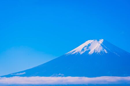 Beautiful landscape of mountain fuji around maple leaf tree with white cloud and blue sky in autumn season at Yamanashi Japanの写真素材