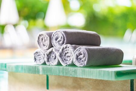 Towel on the table around swimming poolの写真素材