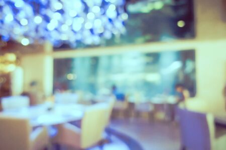 Abstract blur and defocus coffee shop cafe and restaurant interior for backgroundの写真素材