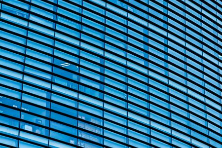 Beautiful business office building skyscraper with window glass textures for backgroundの写真素材