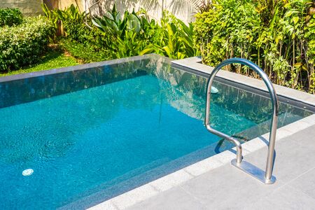 Beautiful landscape outdoor swimming pool in hotel and resort for leisure vacation and travel
