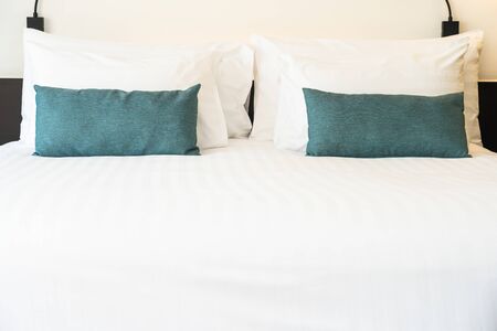 Beautiful luxury and comfortable bedroom interior decoration with white pillow blanket light lamp of...