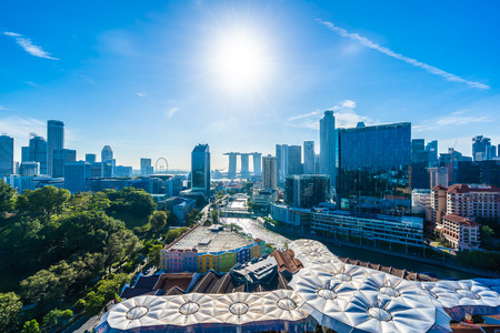 Beautiful architecture building exterior cityscape in Singapore city skyline with white cloud on blue skyのeditorial素材