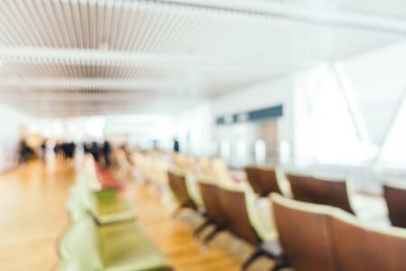 Abstract blur and defocused airport terminal passenger for transportation or business travel interiorの写真素材