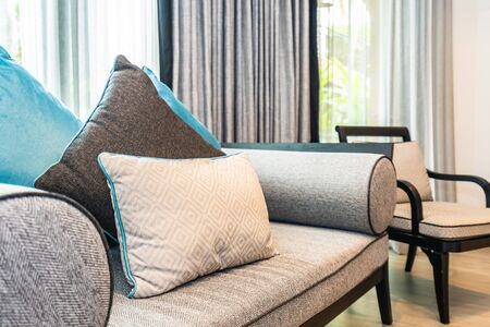 Beautiful comfortable pillow on sofa bed decoration in living room area interior