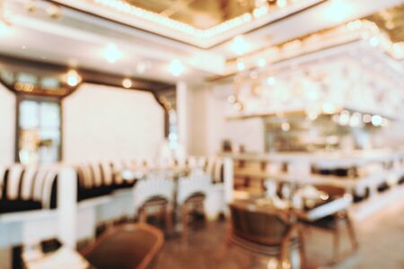 Abstract blur and defocused coffee shop cafe and restaurant interior for backgroundの写真素材