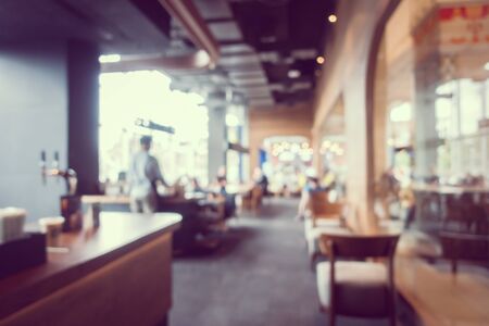Abstract blur and defocus coffee shop cafe and restaurant interior for backgroundの写真素材