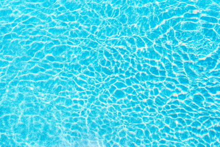 Abstract pool water surface and background with sun light reflection for text copy space
