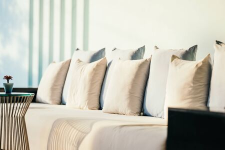 Beautiful luxury comfortable pillow on sofa furniture decoration in living area interior of roomの写真素材