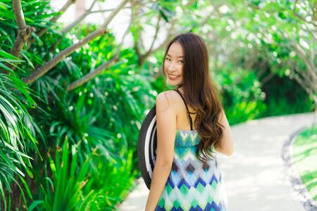 Portrait beautiful young asian woman smile and happy around outdoor gardenの写真素材